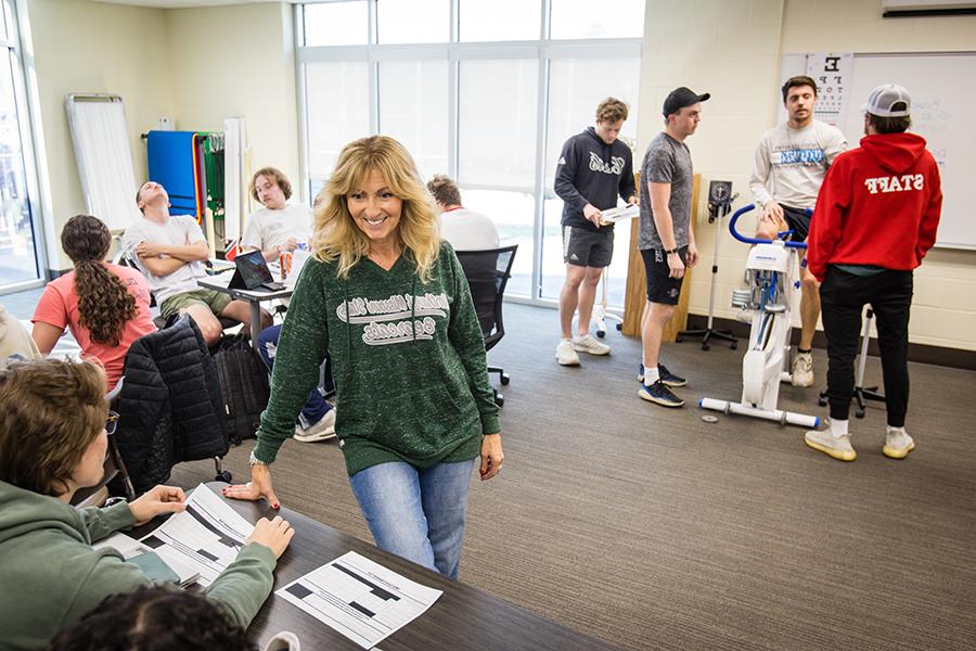 Dr. Tina Gaa Pulley, pictured with students during an exercise testing class this spring, leads Northwest's Exercise is Medicine initiative. (Photo by Lauren Adams/Northwest Missouri State University)
 